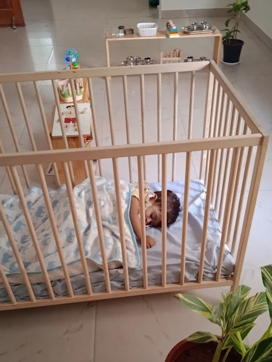 Toddler sleeping in a Crib in Daycare